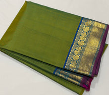 Nayaki- Gorgeous Parrot Green with Peacock Blue tone  Handwoven Pure Kanjivaram Silk with beautiful bawanchi borders with rich pallu and contrast woven blouse