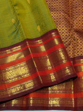 Vaibhogam- Gorgeous Olive Green with Deep Maroonish Brown Handwoven Pure Jari Korvai Kanjivaram Silk with beautiful Varisaipet borders rich pallu and contrast woven blouse