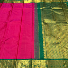 Sarasangi- Dual tone Rani Pink Short Tomato with Deep Emerald Green Handwoven Pure Korvai Kanjivaram Silk with rich borders gorgeous pallu and contrast woven blouse