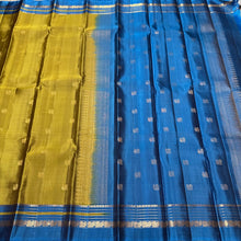 Sahana-Gorgeous Dual tone Sampanga mustard tinted green with teal blue buttas handwoven Pure Kanjivaram with small varisai borders rich buttas woven pallu and contrast woven blouse