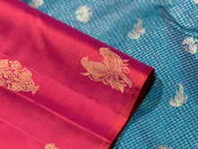 Dual tone Orange Tomato Pink with Peacock Blue Borderless Muthukattam with Double Parrot & Floral Motifs with rich parrots woven pallu and contrast blouse in Handwoven Pure Jari Kanjivaram Silk Saree Beauty