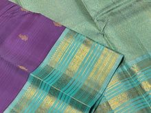 Vaibhogam- Gorgeous Medium Lavendar with Turquoise Blue Handwoven Pure Jari Korvai Buttas Woven Kanjivaram with Rich Varisaipet Borders Beautiful Pallu and Contrast Woven Blouse