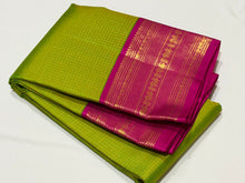 Vaibhogam- Stunning Parrot Green with Rani Pink Vairaoosi Checks Handwoven Pure Jari Korvai Kanjivaram Silk with beautiful rich borders gorgeous pallu and contrast Vairaoosi blouse