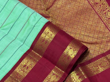 Vaibhogam-Gorgeous Korvai Veldhari in a beautiful pastel green with peacock blue and arakku Ganga Jamuna Borders Handwoven Pure Jari Kanjivaram Silk with rich pallu and contrast woven blouse beauty