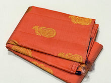 Saranga- Beautiful Peach with Navy Blue Borderless Handwoven Pure Jari Kanjivaram Silk with Muthukattam and Paisleys with peacock and annapakshi Buttas woven body with rich pallu and contrast navy blue blouse!