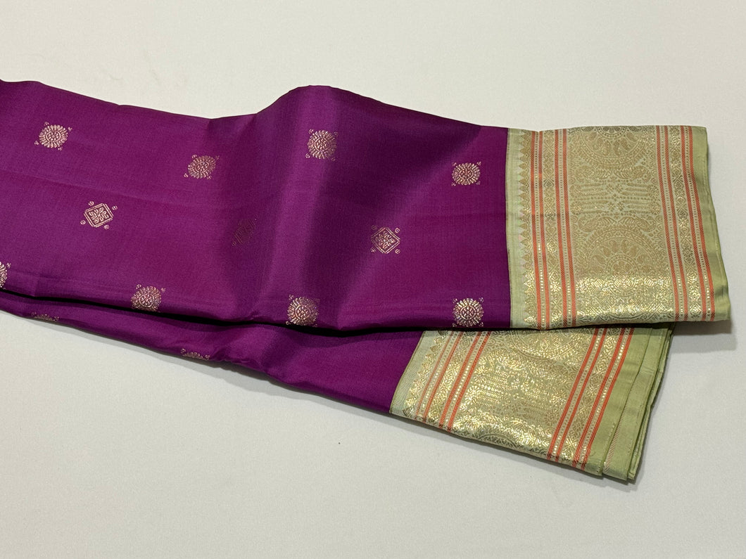 Deep Purple with Elakka Green in Kai Korvai Buttas Kanjivaram Silk Saree with beautiful diamonds and rudrakshas woven body intricate thambalam motifs woven borders rich pallu and contrast woven blouse