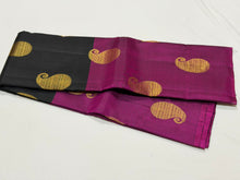 Saranga-Gorgeous Mubbakam Style Handwoven PureKanjivaram Silk in a beautiful black and deep magenta combination with middle portion in black and eithersides in deep magenta color with muthukattam striped body with paisleys woven with rich pallu and blouse