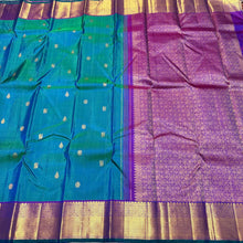 Sahana- Beautiful Peacock Bluish Green with Purple Handwoven Pure Kanjivaram Silk with chakram and thilagam buttas woven body with rich borders beautiful pallu and contrast woven blouse