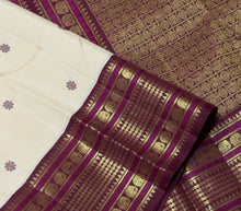 Vaibhogam- Gorgeous Offwhite with Maroonish Brown Handwoven Pure 2g jari Korvai with Buttas Kanjivaram Silk with beautiful thread kamalam buttas woven body with rich varisaipet small elephants and neli veldhari borders rich pallu and contrast woven blouse