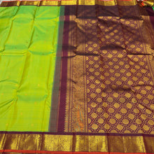 Vaibhogam-Gorgeous Sneha Green with Deep Maroonish Brown Handwoven Pure Jari Korvai Kanjivaram Silk with beautiful kolam buttas woven body with rich borders with orange selvedes gorgeous pallu with polka dots woven and contrast woven blouse