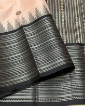 Saraswati-Gorgeous Handwoven Pure Zariless Korvai Kanjivaram Silk in a beautiful and rare peachish sandal shade with Black combination with beautiful kasuti style buttas woven beautiful body with varisaipet borders rich pallu and contrast woven blouse