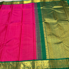 Sarasangi- Dual tone Rani Pink Short Tomato with Deep Emerald Green Handwoven Pure Korvai Kanjivaram Silk with rich borders gorgeous pallu and contrast woven blouse