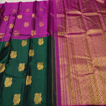 Saranga- Super Gorgeous Bottle Green with Deep Magenta Handwoven Pure Kanjivaram Silk woven in half and half style with muthukattam vertical stripes running vertically all over the body with peacocks woven body rich pallu and contrast woven blouse