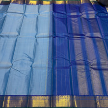 Nayaki- Gorgeous Powder Blue with Peacock Blue Handwoven Pure Jari Kanjivaram Silk with bawanchi borders rich seer pallu and contrast woven blouse