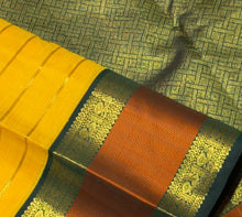 Vaibhogam- Stunning Yellow with Bottle Green Handwoven Pure2g Jari Korvai Kanjivaram Silk with Jari Veldhari woven body with rich silk threads and Jari woven beautiful borders gorgeous pallu and contrast woven blouse