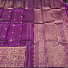 Vaibhogam- Stunning Deep Purple with Gold Handwoven Pure 2g Jari Kanjivaram Silk with beautiful yazhi and mayil buttas woven body with rich Vanasingaram borders on either sides with rich pallu and self colored blouse