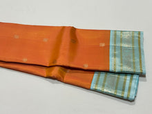 Dual tone Soft Orange with Powder Blue Buttas Handwoven Kai Korvai Kanjivaram Silk Saree with Rich borders pallu and contrast woven blouse beauty