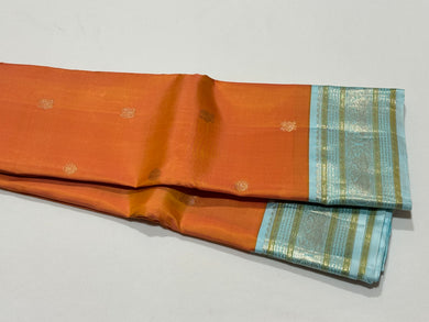 Dual tone Soft Orange with Powder Blue Buttas Handwoven Kai Korvai Kanjivaram Silk Saree with Rich borders pallu and contrast woven blouse beauty