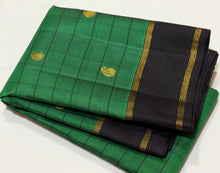 Sahana- Gorgeous Emerald Green with Black Handwoven Pure Jari Checked Kanjivaram Silk with paisleys woven checks with beautiful rettapet bodi borders gorgeous pallu and contrast woven black blouse