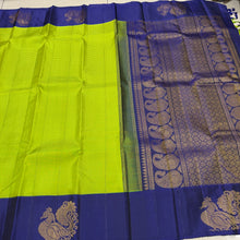 Vaibhogam- Stunning Parrot Green  with Deep Blue  Handwoven Pure Jari Korvai Kanjivaram Silk with beautiful muted checks woven body with gorgeous Hamsas woven on either side of the borders with beautiful rich paisleys wovepallu and contrast Blue blouse