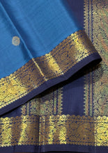 Vaibhogam- Mesmerizing Royal Azure Blue with Navy Blue Handwoven Pure 2g Jari Korvai Kanjivaram Silk with Buttas woven body with beautiful small intricate borders rich pallu and contrast navy blue blouse