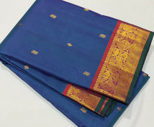 Sahana- Stunning Peacock Blue with Rustic Orange Buttas Handwoven Pure Jari Kanjivaram Silk with beautiful borders with green selvedges rich pallu and contrast woven blouse