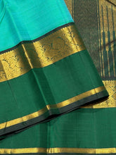 Vaibhogam- Beautiful Light Green with Dark Bottle Green Handwoven Pure Zari Korvai Kanjivaram Silk with beautiful spaced light and dark green double borders rich seer pallu and contrast woven bottle green blouse