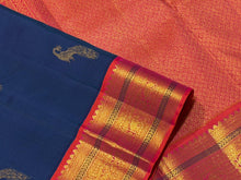 Vaibhogam- Gorgeous Peacock Blue with Orange Pink Handwoven Pure Jari Korvai Kanjivaram Silk with beautiful peacock buttas woven body with rich borders pallu and contrast woven blouse