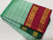 Vaibhogam- Gorgeous Pastel Green with Ganga Jamuna Bottle Green and Arakku Red borders with Neli Veldhari woven beautiful body with fishpet double borders rich pallu and contrast woven blouse