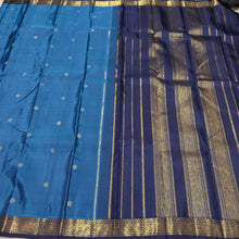Vaibhogam- Mesmerizing Royal Azure Blue with Navy Blue Handwoven Pure 2g Jari Korvai Kanjivaram Silk with Buttas woven body with beautiful small intricate borders rich pallu and contrast navy blue blouse