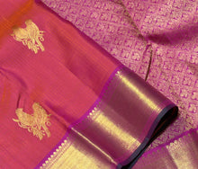 Vaibhogam -Gorgeous Dual tone Orange with Pink with Double Bird Buttas Handwoven Pure Jari Kanjivaram Silk with muthukattam woven body with rich bawanchi borders with green selvedges beautiful pallu with floral buttas woven with contrasting pink blouse