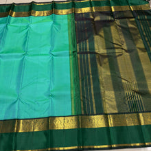 Vaibhogam- Beautiful Light Green with Dark Bottle Green Handwoven Pure Zari Korvai Kanjivaram Silk with beautiful spaced light and dark green double borders rich seer pallu and contrast woven bottle green blouse