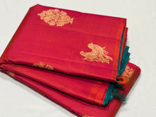 Dual tone Orange Tomato Pink with Peacock Blue Borderless Muthukattam with Double Parrot & Floral Motifs with rich parrots woven pallu and contrast blouse in Handwoven Pure Jari Kanjivaram Silk Saree Beauty