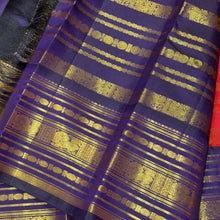 Vaibhogam- Gorgeous Red with Deep Blue Handwoven Pure 2g Jari Kanjivaram Silk with beautiful Jari veldhari striped body with different patterns rich varisaipet borders gorgeous pallu and contrast deep blue jari woven blouse