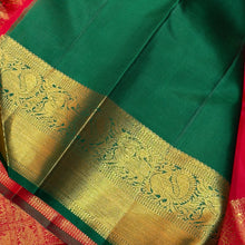 Sahana- Mesmerising Red with Green Handwoven Pure Jari Buttas woven Kanjivaram Silk with beautiful gandaberundas and jewelery motits woven body rich bawanchi borders with green selvedges beautiful pallu with unique motifs woven and contrast green blouse.