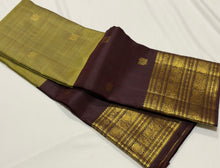 Vaibhogam- Gorgeous Elaichi Green with Coffee Brown Vairaoosi with Buttas Handwoven Pure 2g Jari Kanjivaram Silk with beautiful broad coffee brown borders rich pallu and contrast woven blouse