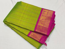 Sarasangi- Stunning Parrot Green with Pink Handwoven Pure Jari Korvai Kanjivaram Silk with beautiful checked body rich borders pallu and contrast woven blouse