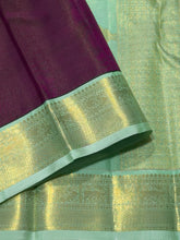 Vaibhogam- Mesmerizing Deep wine with pastel green Handwoven Pure 2g Jari Korvai Vairaoosi body with beautiful yazhis and annapakshis woven borders rich yazhi buttas woven beautiful pallu and contrast woven blouse