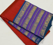 Vaibhogam- Stunning Burnt Orange Red with Peacock Blue Handwoven Pure Jari Korvai Kanjivaram Silk with Plain body rich varisaipet borders beautiful peacock blue pallu and contrast woven blouse