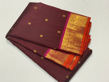 Chocolate Brown with Pink Buttas Handwoven Pure Kanjivaram Silk with beautiful Gandaberundas woven rich borders with orange selvedges rich pallu and contrast woven blouse