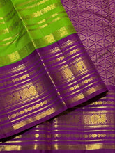 Vaibhogam- Stunning Parrot Green with Purple Handwoven Pure Zari Korvai Kanjivaram Silk with Beautiful Jari Veldhari woven body with rich varisaipet borders gorgeous palli and contrast veldhari stripes woven blouse