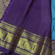 Sahana- Beautiful Teal Blue with Aubergine Purple Handwoven Pure 2g Jari Kanjivaram Silk with beautiful buttas woven body with rich elephants woven borders gorgeous pallu and contrast woven blouse