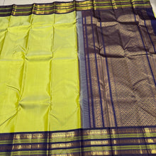Gorgeous Pastel Green with Navy Blue Handwoven Pure Jari Korvai Plain Body Kanjivaram Silk Saree with rich Varisaipet Meenakari Borders Rich Pallu and Contrast Woven Blouse