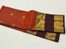 Vintage Beauty in a Rich Rust and Dark Brown Combination with Vairaoosi Jari Kattam with Mayil Chakram Buttas Doublepet borders rich pallu and contrast woven blouse