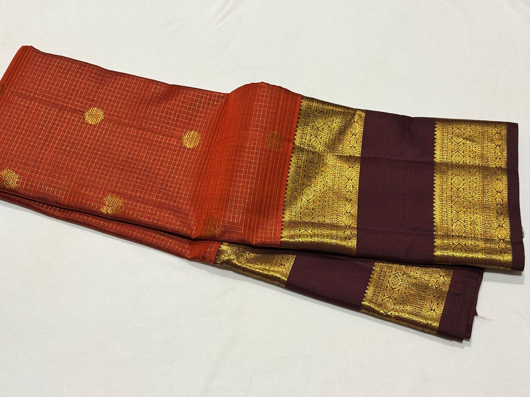 Vintage Beauty in a Rich Rust and Dark Brown Combination with Vairaoosi Jari Kattam with Mayil Chakram Buttas Doublepet borders rich pallu and contrast woven blouse