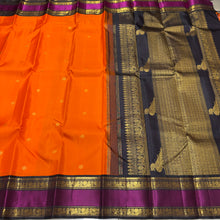 Vaibhogam- Stunning Fanta Orange with Kanchana Black Handwoven Pure Jari Korvai Kanjivaram Silk with beautiful buttas woven body with intricate doublepet with middle silk thread woven borders gorgeous kalakshetra parrots woven pallu and contrast blouse