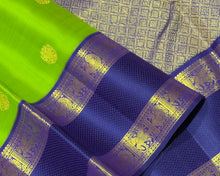 Vaibhogam- Gorgeous Bright Green with Deep Blue Handwoven Pure 2g Jari Korvai Kanjivaram Silk with beautiful chakram and gandaberunda motifs woven body with beautiful silk threads and jari woven doublepet borders gorgeous pallu and contrast woven blouse