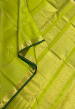 Sahana- Stunning Bright Lime Green with Gold Small Borders with Buttas Handwoven Pure Kanjivaram Silk with Bottle Green Selvedges Rich Pallu and Self Colored blouse