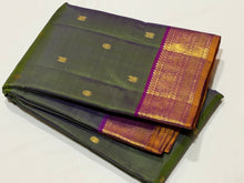 Nayaki- Gorgeous Dual tone Green with Purple Handwoven Pure Kanjivaram Silk with Buttas woven body rich borders pallu and contrast woven blouse