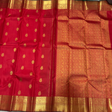 Sahana- Mesmerising Red with Green Handwoven Pure Jari Buttas woven Kanjivaram Silk with beautiful gandaberundas and jewelery motits woven body rich bawanchi borders with green selvedges beautiful pallu with unique motifs woven and contrast green blouse.